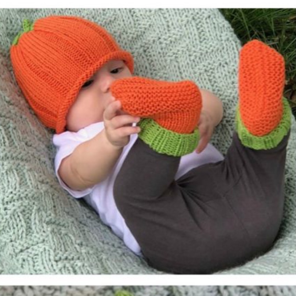 Newborn pumpkin hat and socks are in like new condition